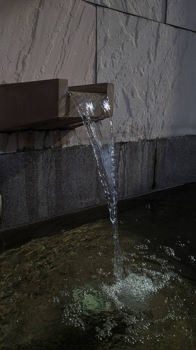 man flexing his muscles in a gym